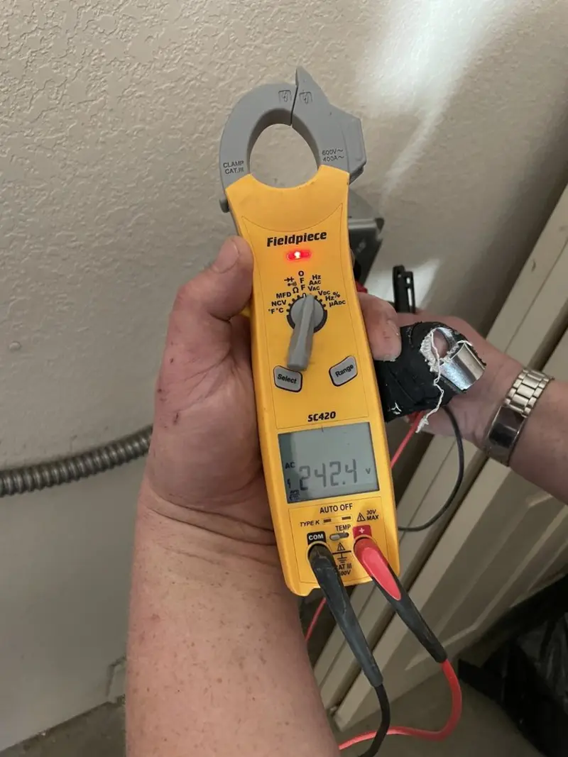 Voltage testing with clamp meter during Whole House Surge Protector in Brier
